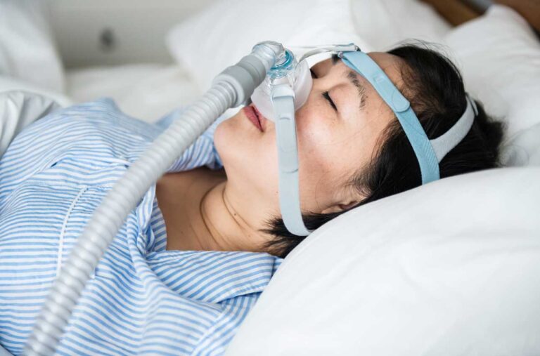 a-woman-wearing-anti-snoring-chin-straps-2023-11-27-05-10-10-utc